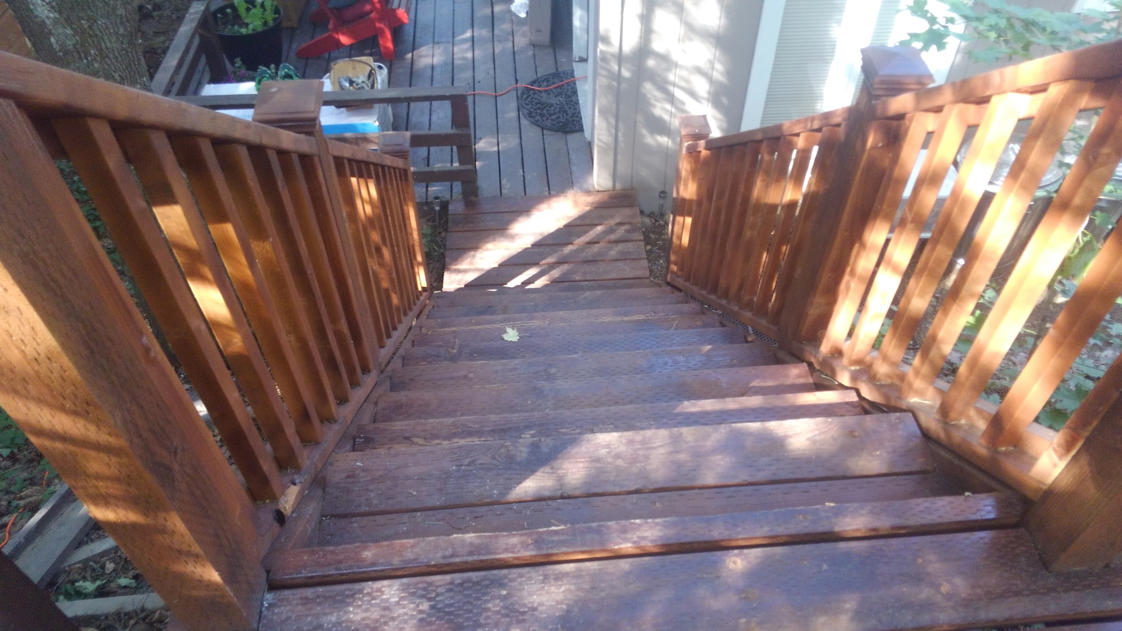 Freshly stained cedar deck staircase