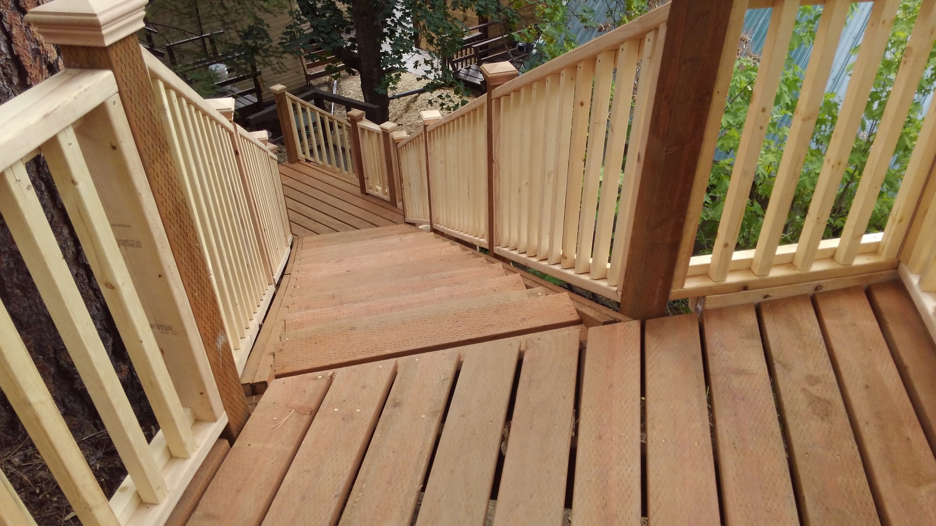 Cedar deck staircase with full railing system