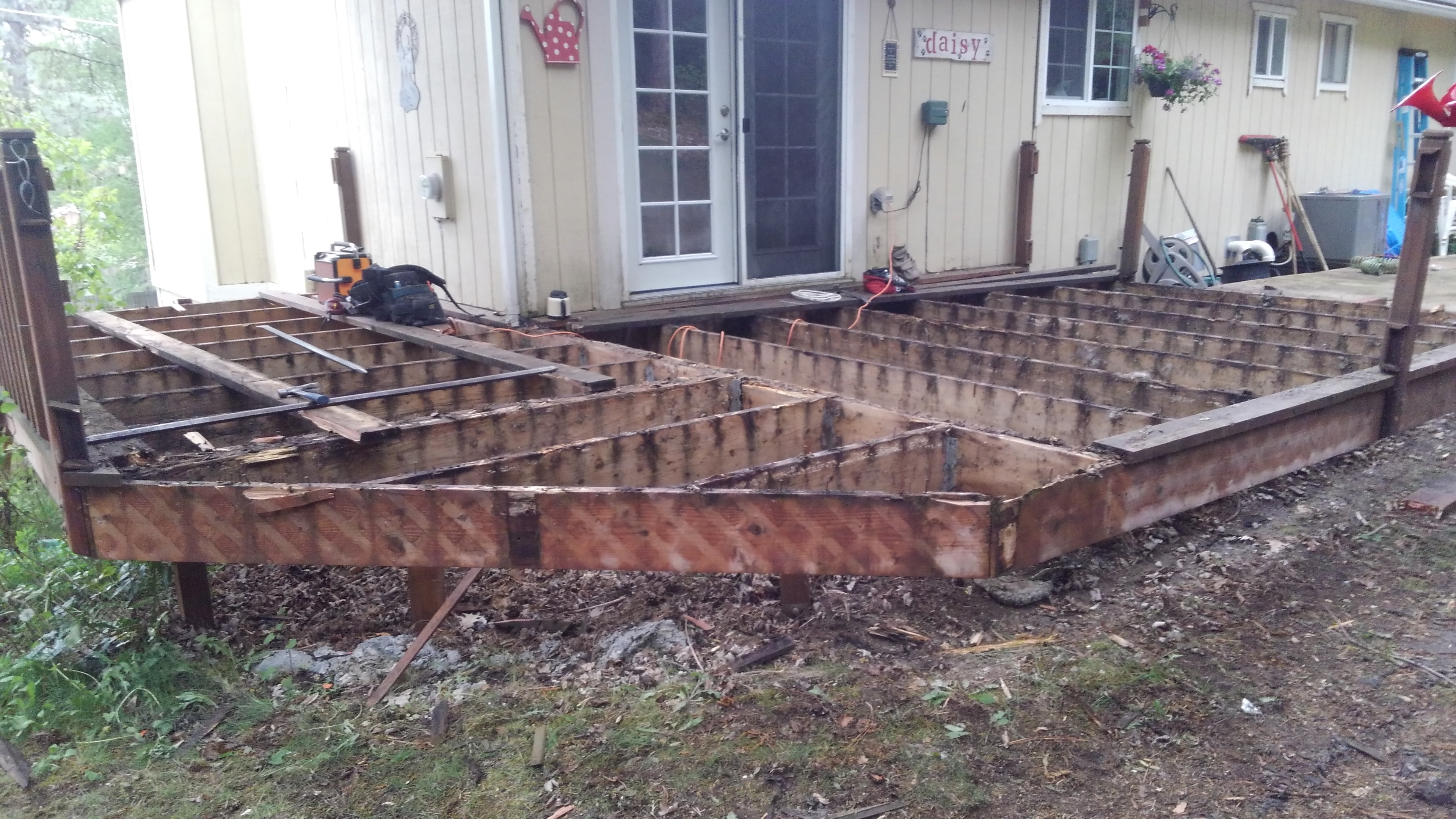 Deck demolition — stripped down to joists