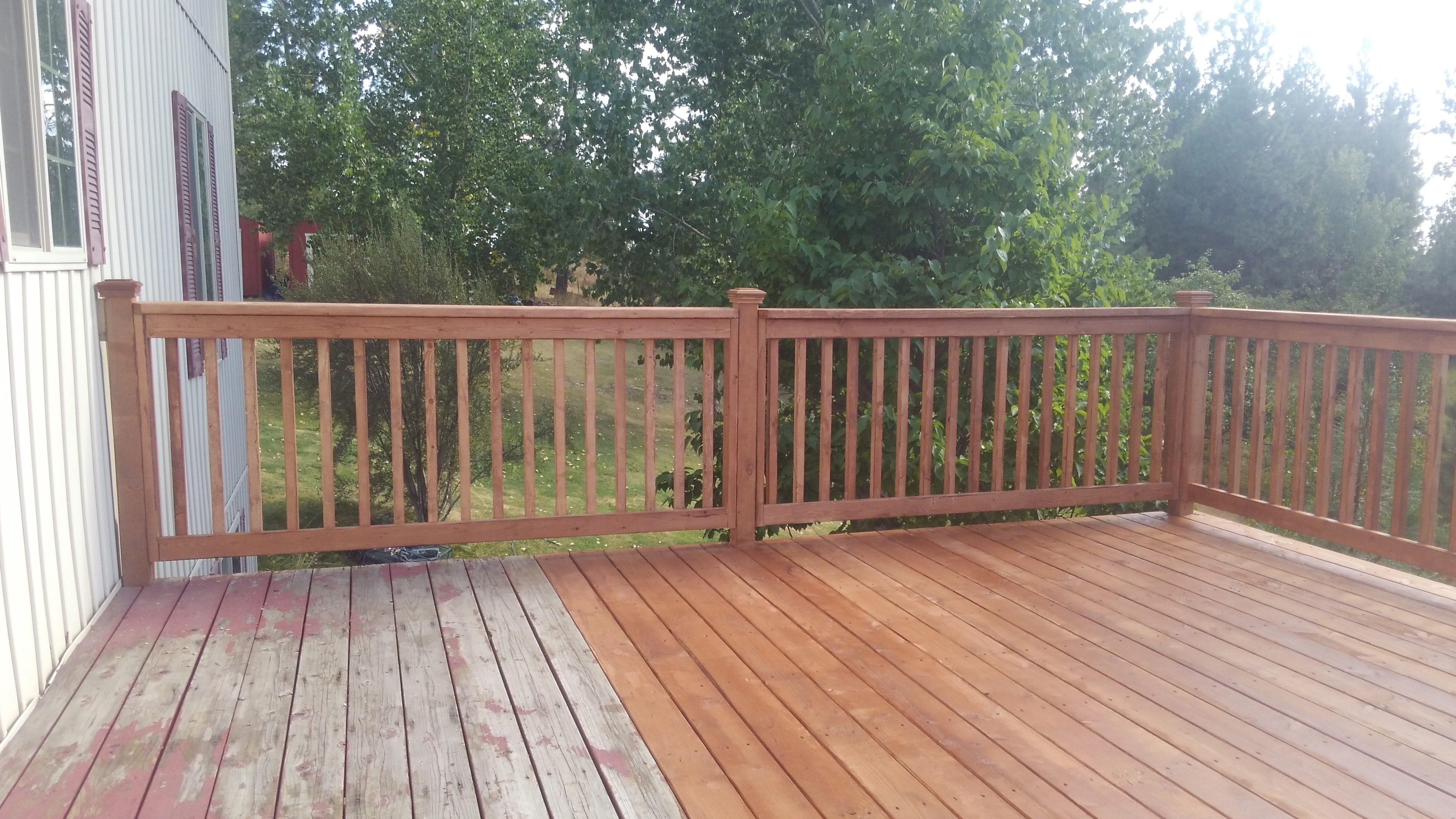 Elevated second-story deck with cedar railings