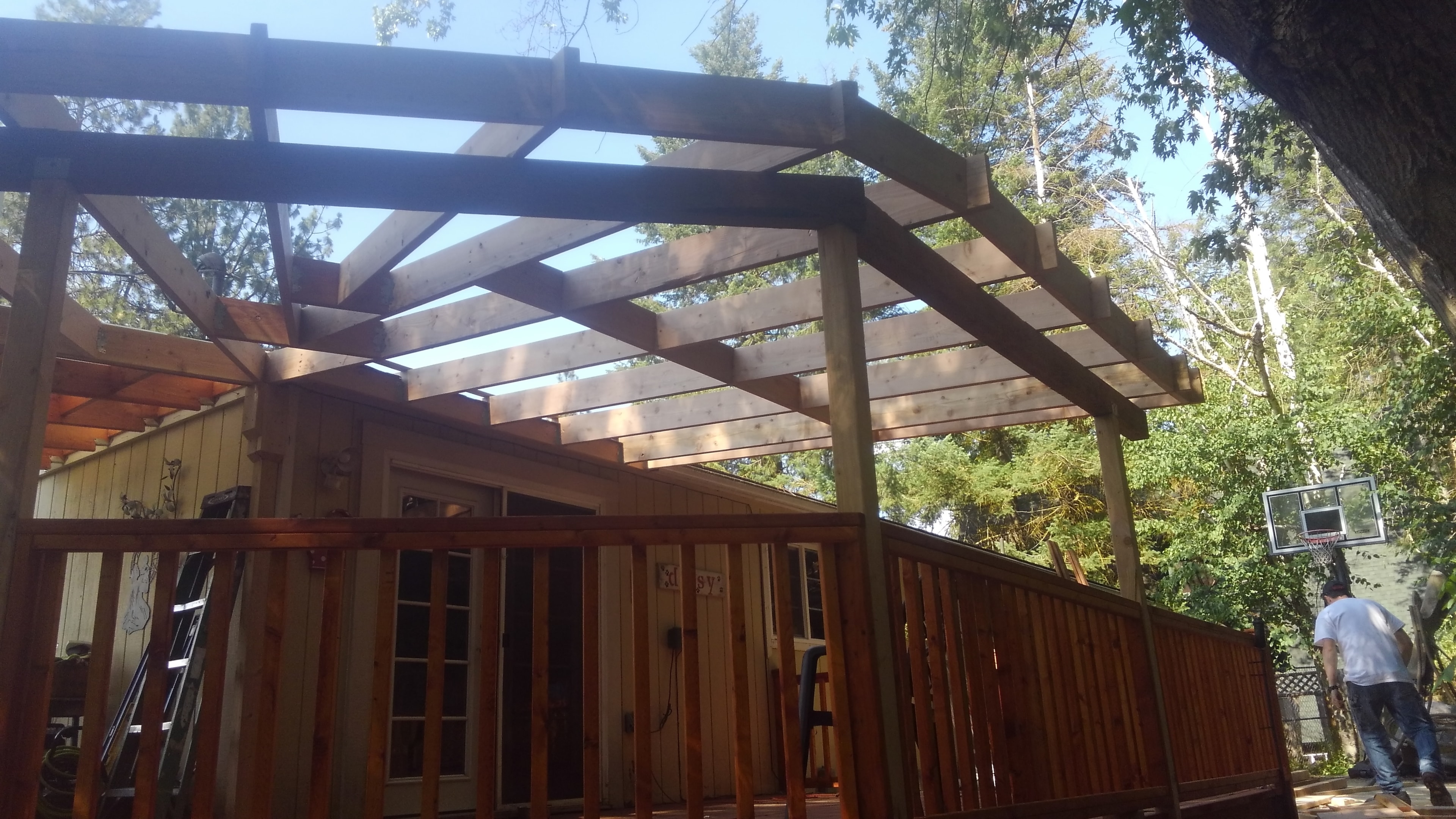 Completed pergola with translucent roof panels