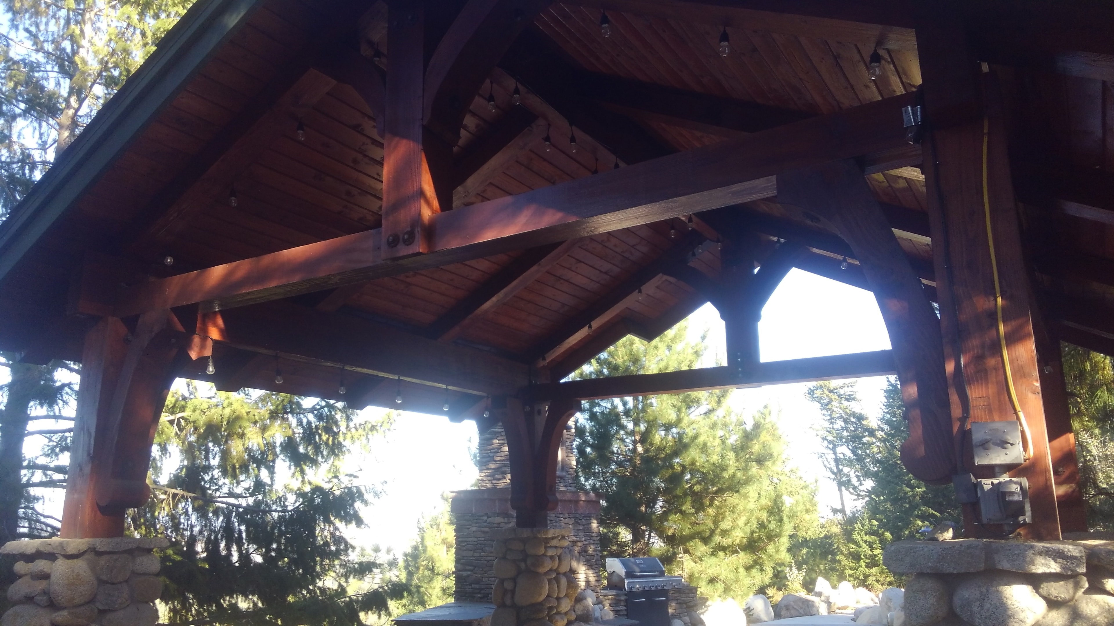 Timber frame pavilion ceiling with string lights