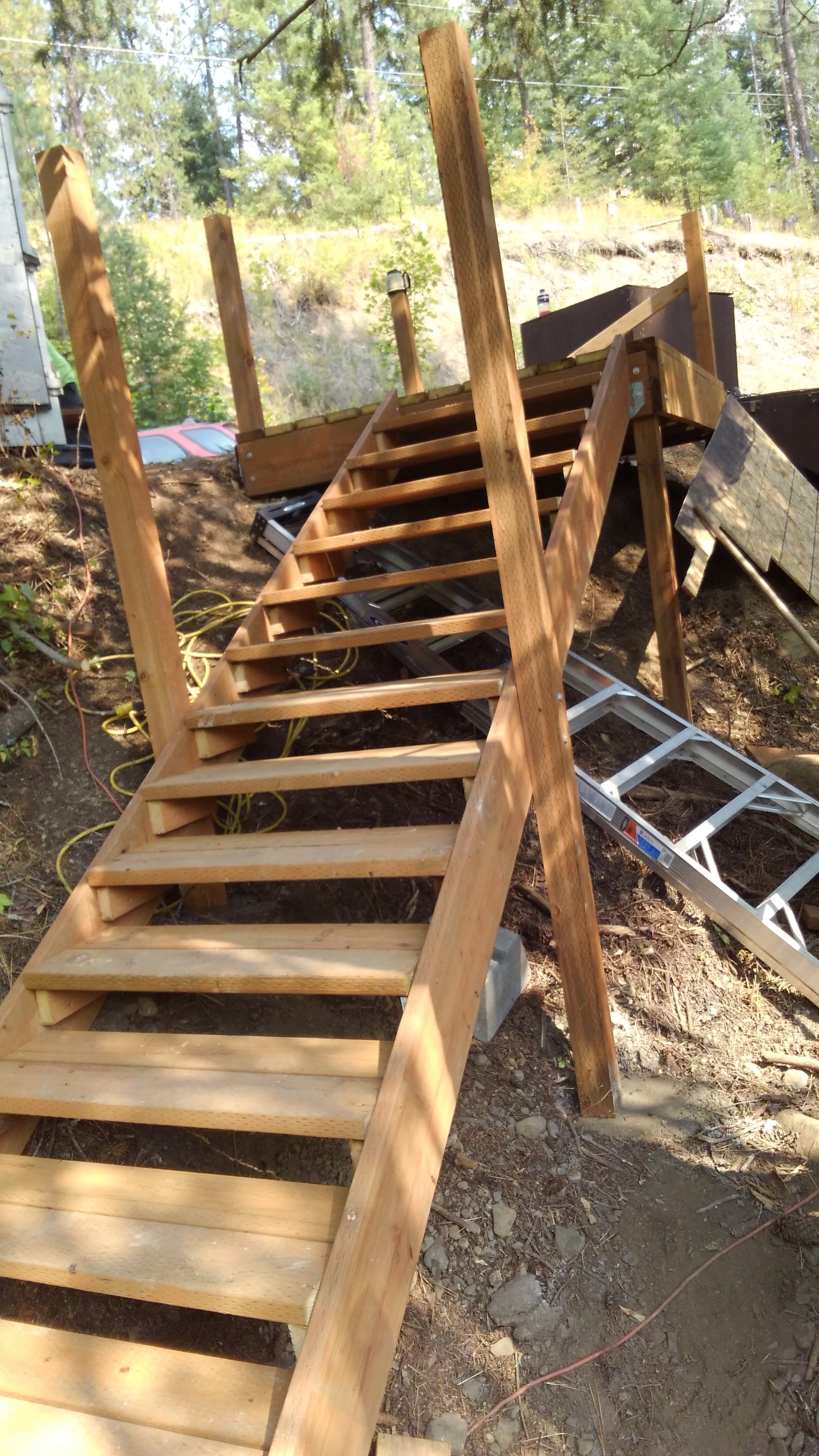 Cedar stair framing on wooded hillside deck
